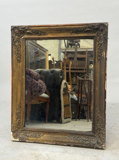 Wood and gilded stucco mirror with foliate...