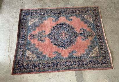 Large hand-knotted wool rug with stylized...