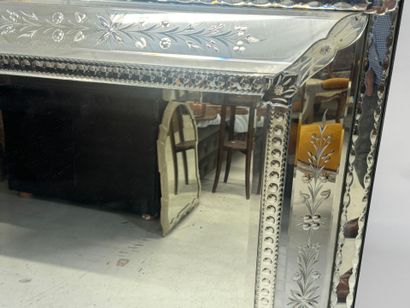 Large Venetian mirror with richly foliated...