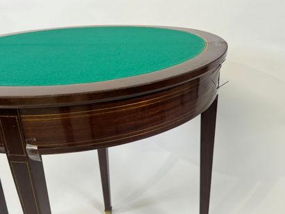 Mahogany veneered half-moon game table.
Louis...