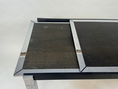 Extendable table in stained wood and chrome.
70s.
73...