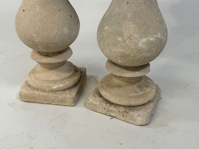 Pair of stone baluster columns, square base.
61...