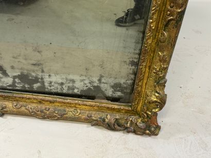 Carved wood mirror with foliate scrolls.
93...
