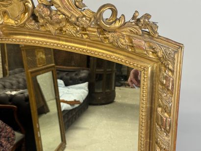 Large wood and gilded stucco mirror with...