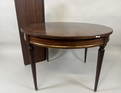 Circular table with molded wood entablature.
Louis...