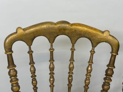 Pair of chairs in molded and gilded wood.
85...