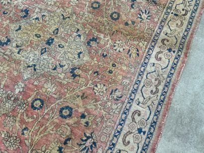 Hand-knotted wool rug decorated with foliate...