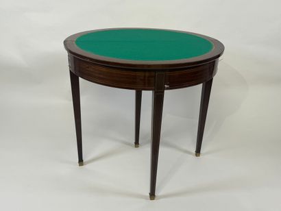 Mahogany veneered half-moon game table.
Louis...