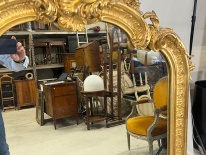 Large gilded and carved wood mirror with...