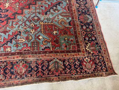 Large hand-knotted wool rug decorated with...