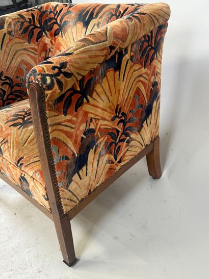 Molded wood armchair with floral velvet upholstery.
70...