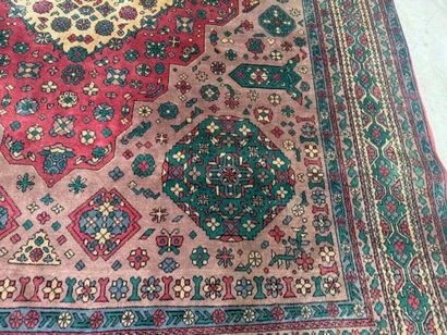 *
Large wool carpet with geometric and stylized...