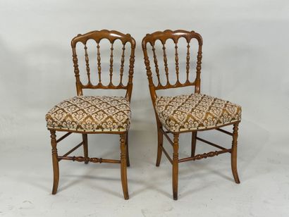 Pair of molded cherrywood chairs, fabric...