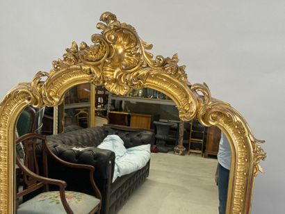 Large gilded and carved wood mirror with...
