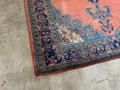 Large hand-knotted wool rug with stylized...