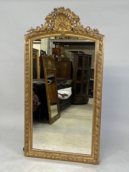 Large wood and gilded stucco mirror with...