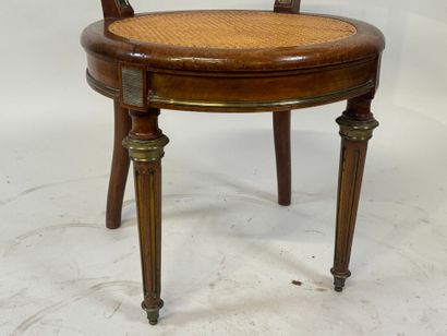 Desk armchair in molded wood and brass, with...