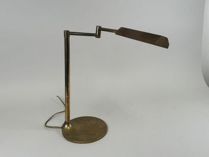 Brass desk lamp, swivel arm, circular base.
H....