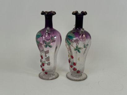 Pair of vases in partially colored and enameled...