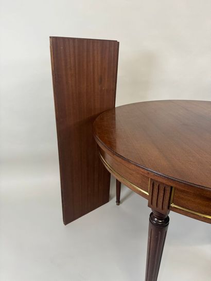 Circular table with molded wood entablature.
Louis...