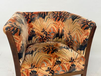 Molded wood armchair with floral velvet upholstery.
70...