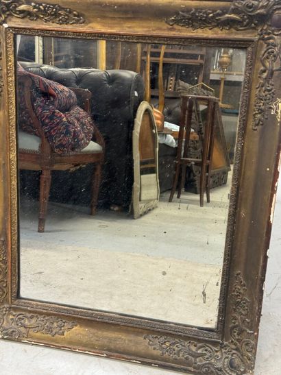 Wood and gilded stucco mirror with foliate...