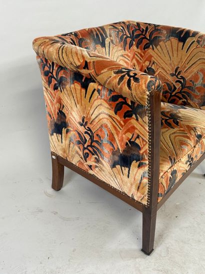 Molded wood armchair with floral velvet upholstery.
70...