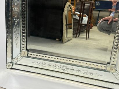 Large Venetian mirror with richly foliated...