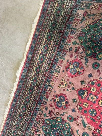 *
Large wool carpet with geometric and stylized...