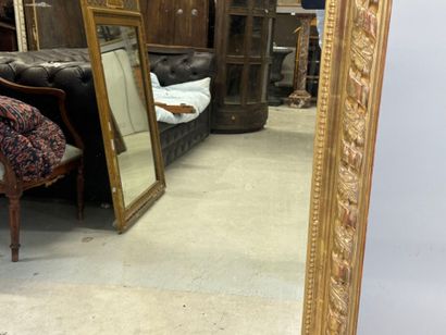Large wood and gilded stucco mirror with...