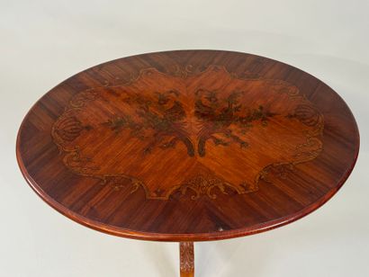 Oval tripod pedestal table in marquetry decorated...