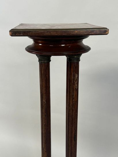Moulded wood and brass sellette with four...