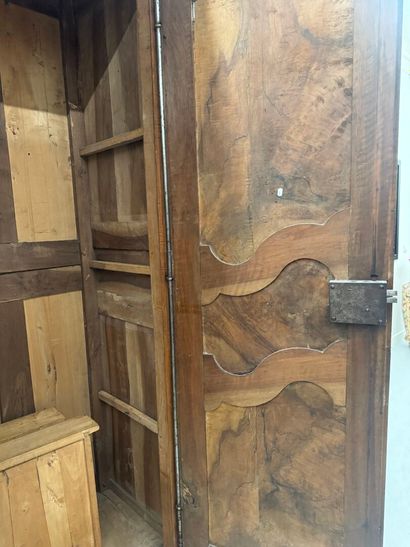 Large walnut armoire opening with two molded...