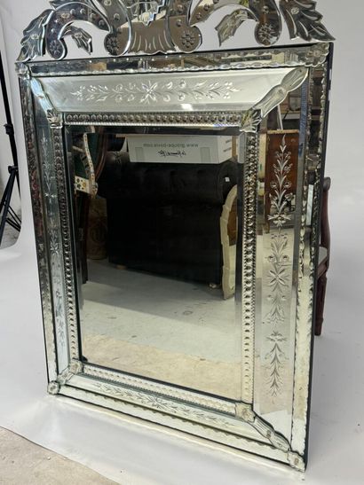 Large Venetian mirror with richly foliated...