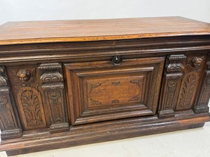 Large molded and carved oak desk decorated...