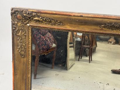 Wood and gilded stucco mirror with foliate...