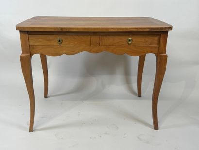 Light wood desk opening with two drawers....