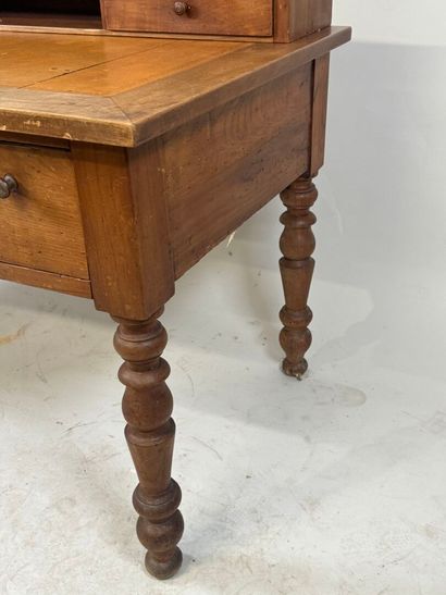 Tiered desk in molded wood opening with three...