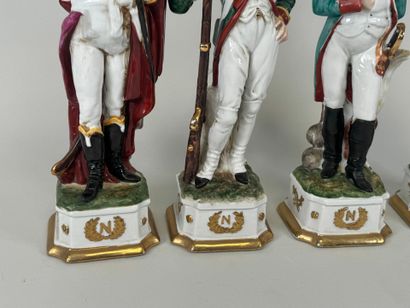 Quatre personnages en porcelaine polychrome...
