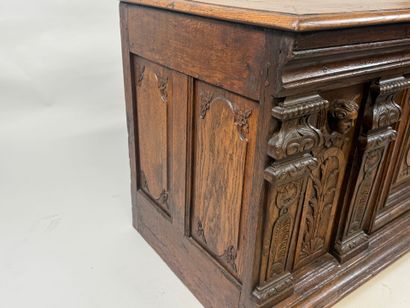 Large molded and carved oak desk decorated...