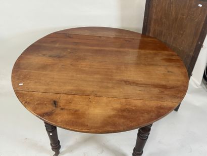 Two-leaf table with six molded wood legs.
73...