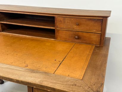 Tiered desk in molded wood opening with three...