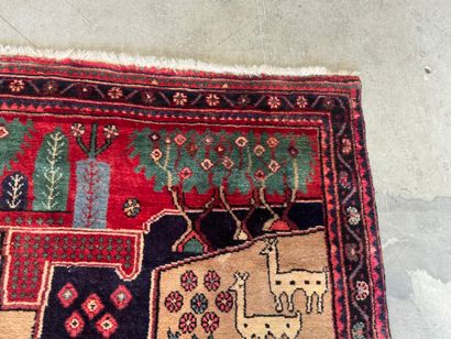 Hand-knotted wool rug decorated with landscapes...