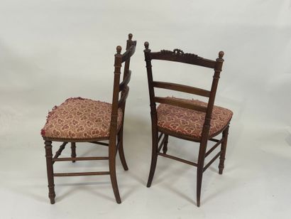 Pair of chairs in molded wood, the openwork...