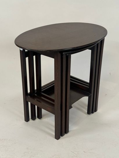 Moulded mahogany nesting tables, one brace...