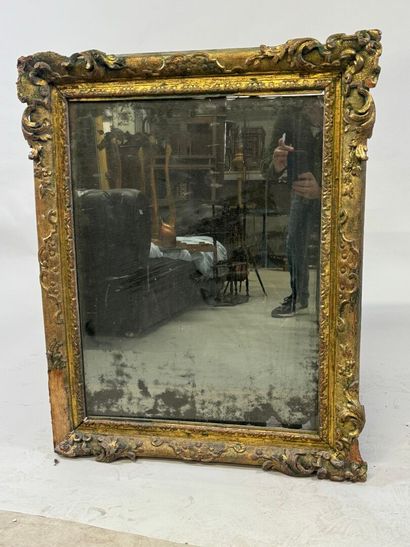 Carved wood mirror with foliate scrolls.
93...