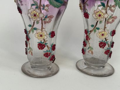 Pair of vases in partially colored and enameled...
