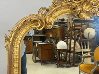 Large gilded and carved wood mirror with...
