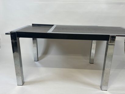 Extendable table in stained wood and chrome.
70s.
73...