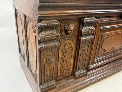 Large molded and carved oak desk decorated...